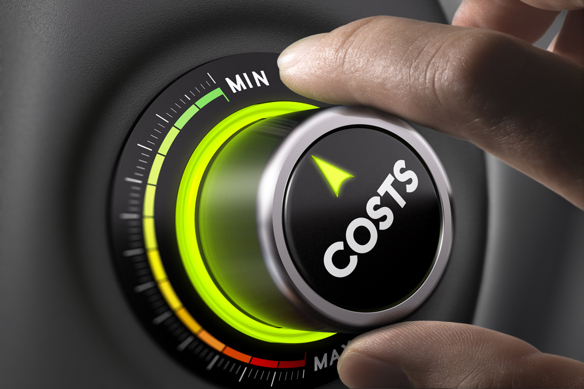 A hand is pressing on a button that has a word cost on it which indicates cost management