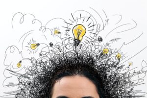 A picture of someone's hair that has lamps on it that indicates creative & critical thinking